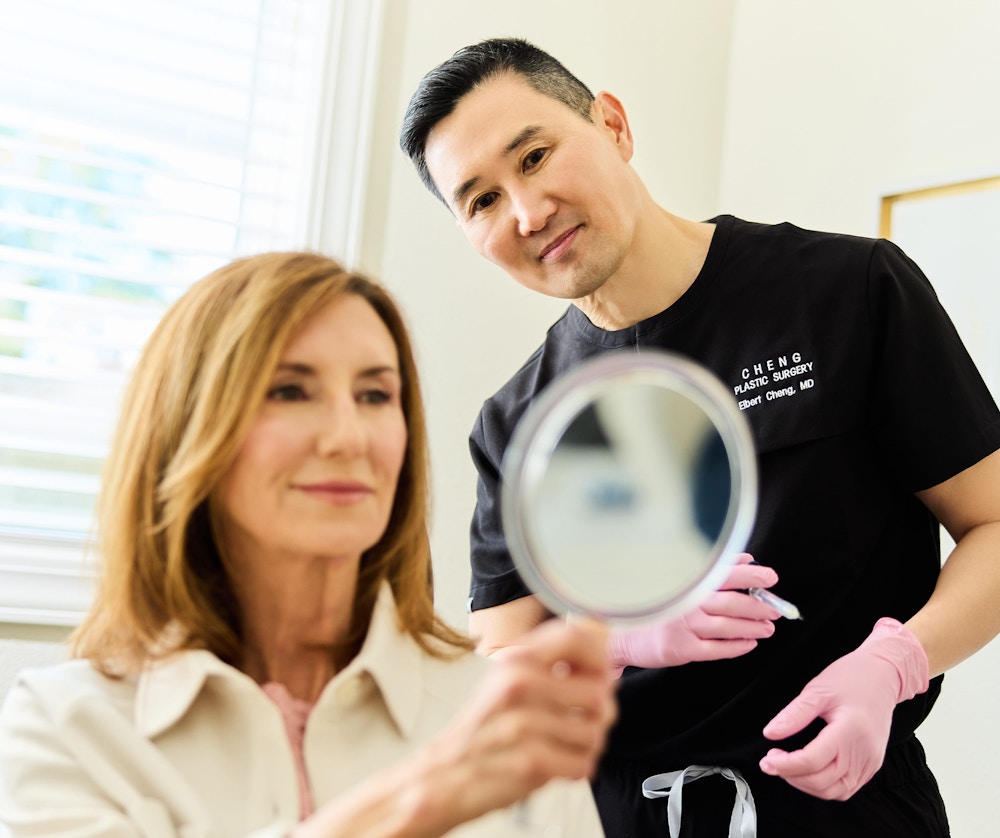 doctor with patient looking in mirror
