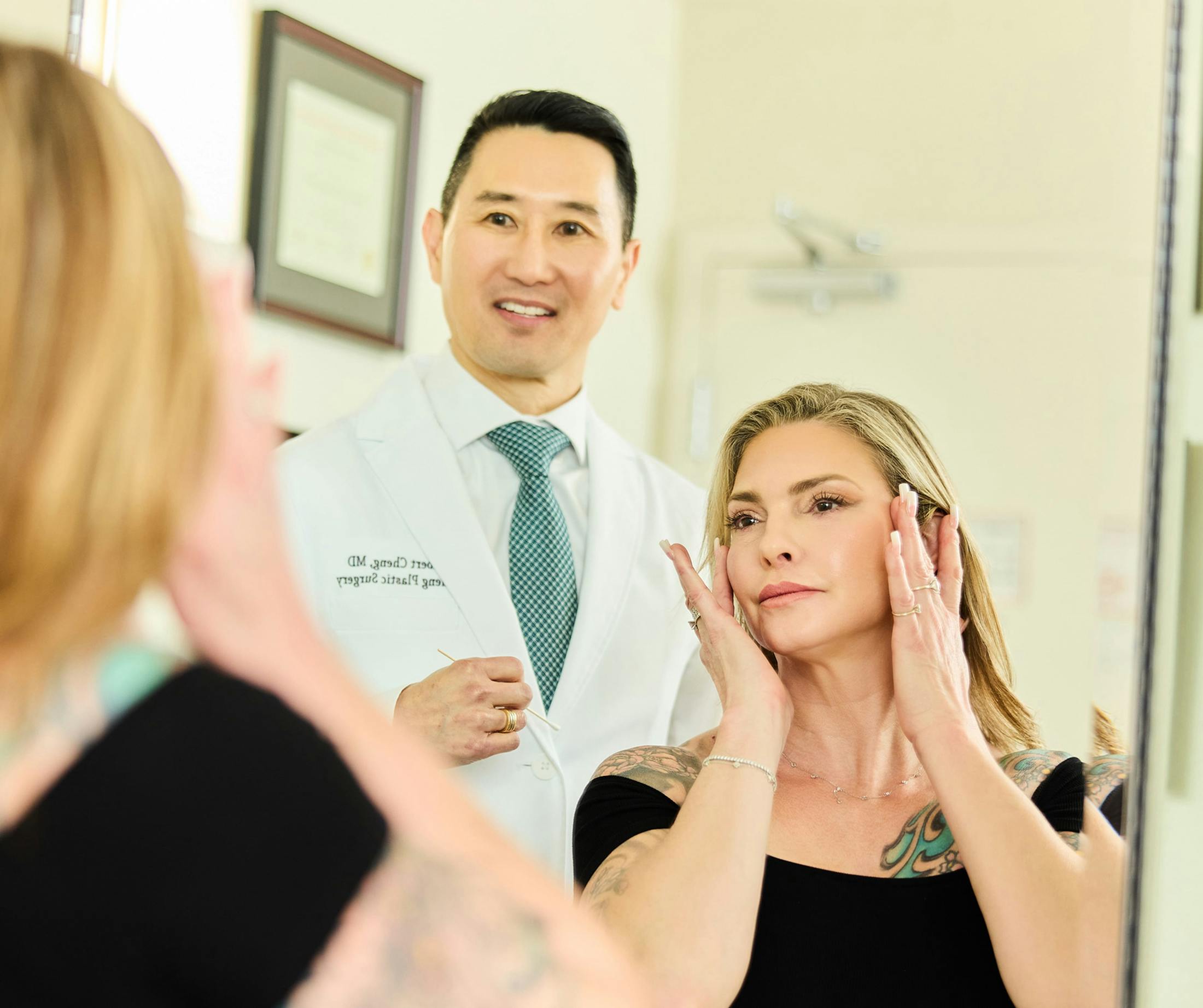 woman and doctor looking in mirror