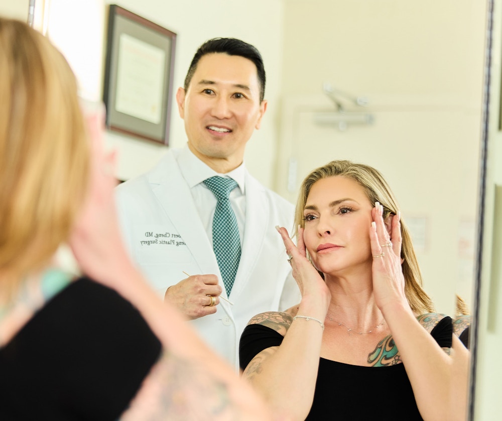 woman and doctor looking in mirror