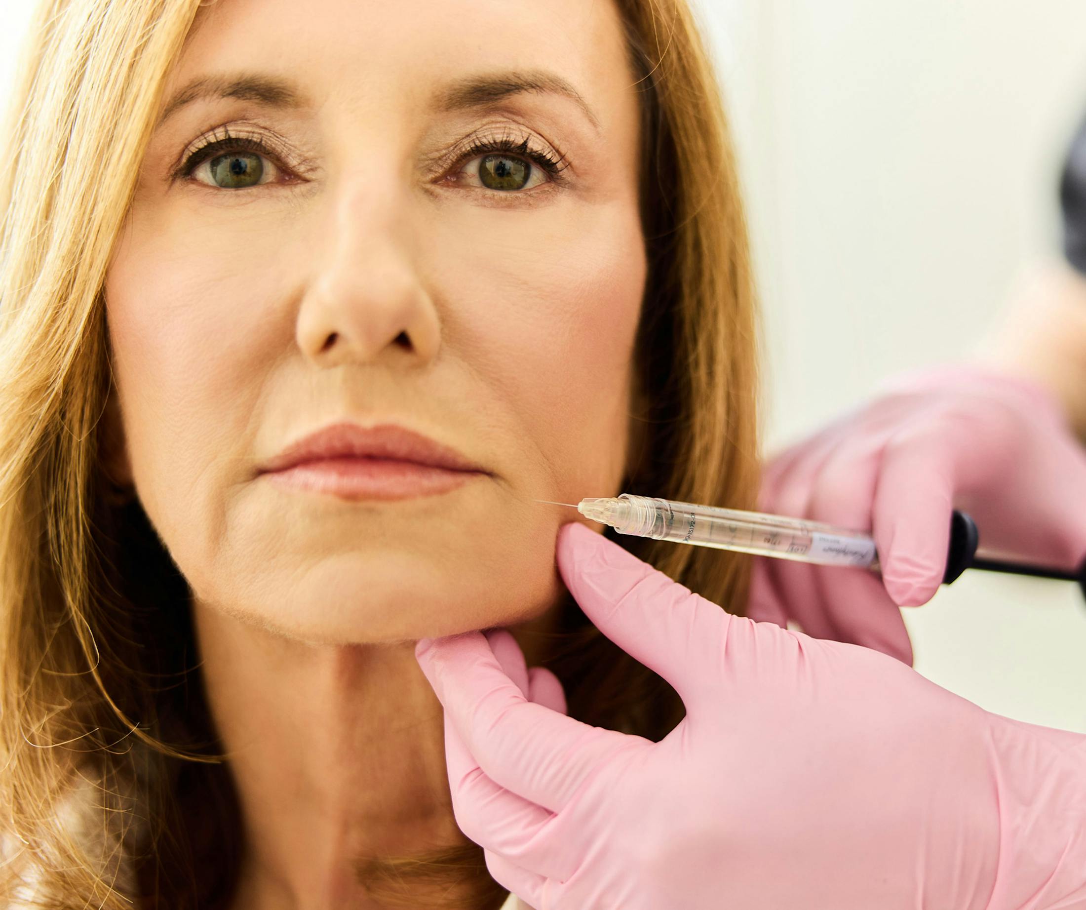 woman receiving lip injections