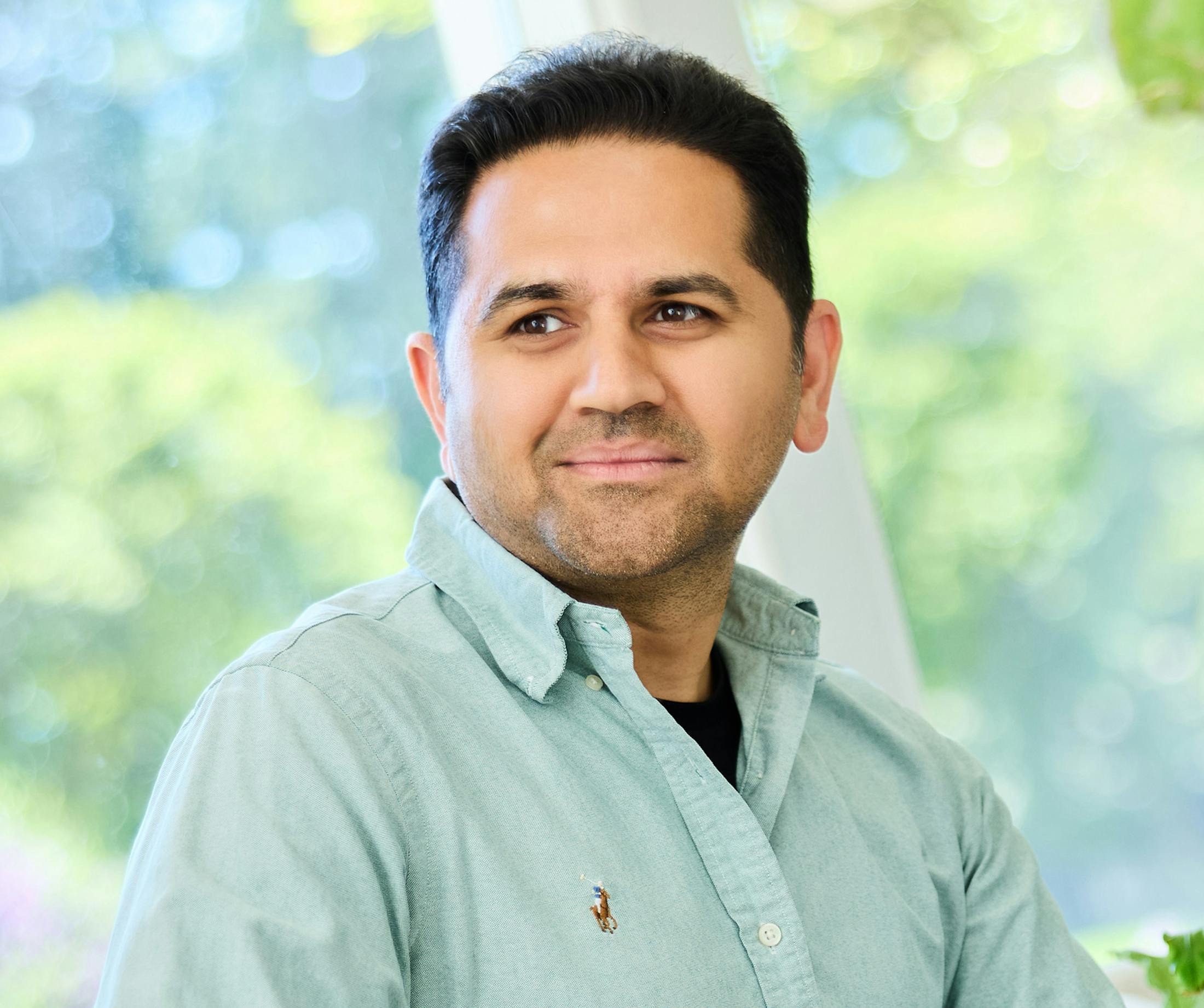 man in a light blue button up shirt