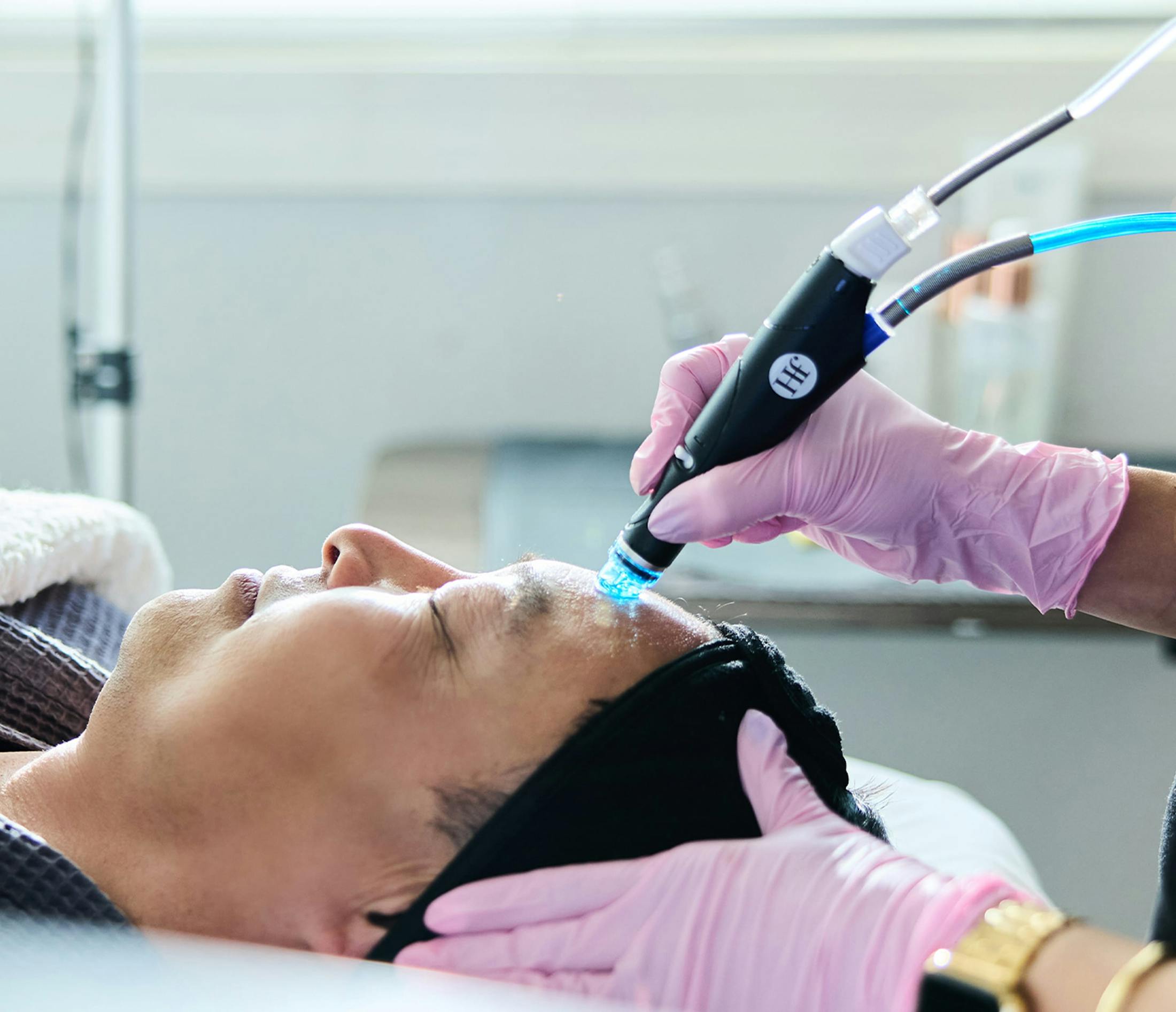 woman with glasses smiling