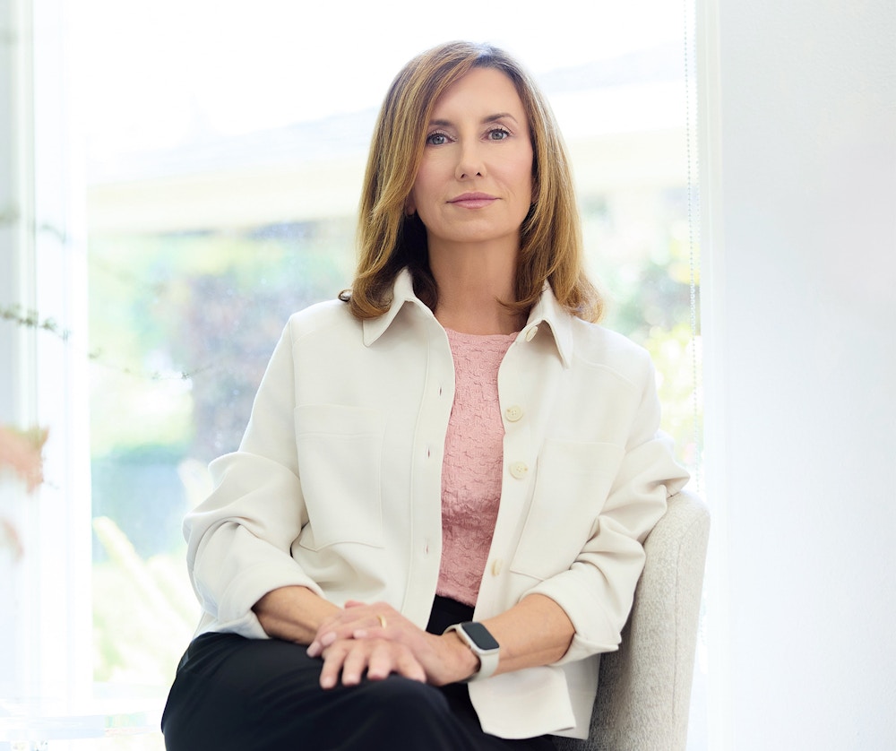 woman in a white jacket