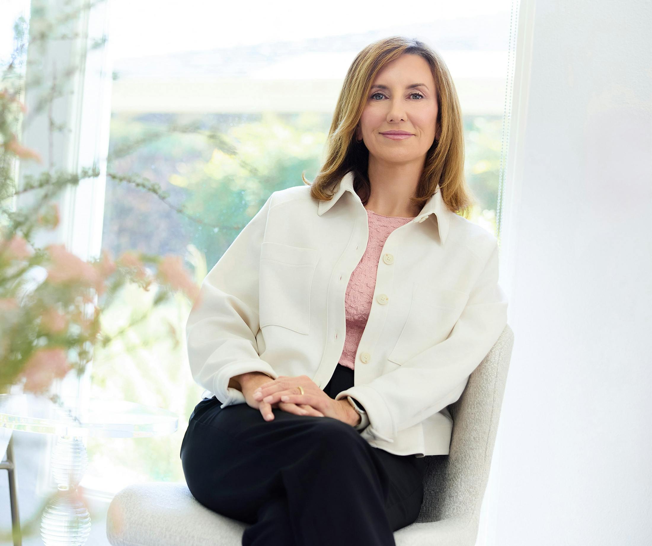 woman in a white jacket