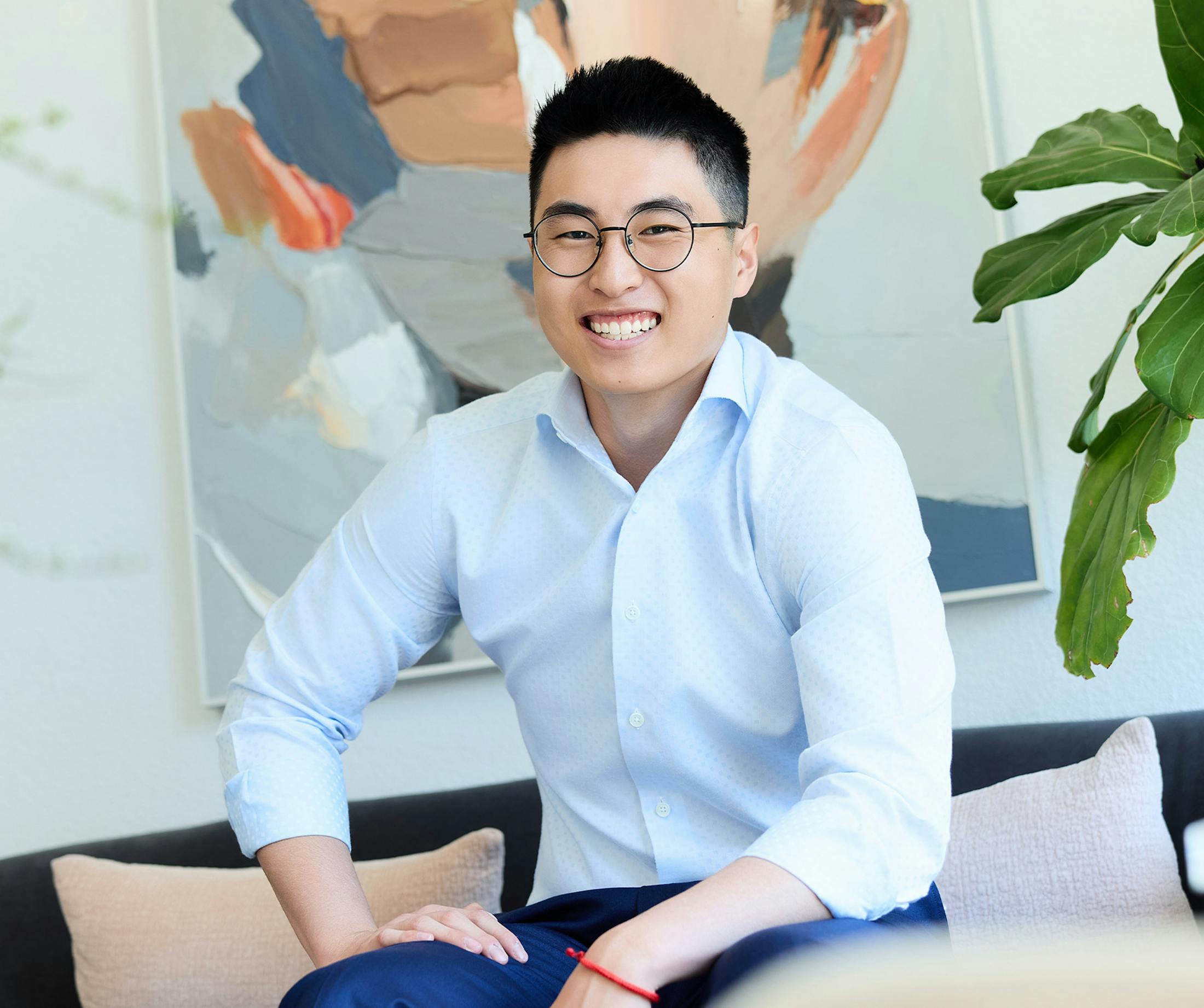man in a long sleeve light blue button up top