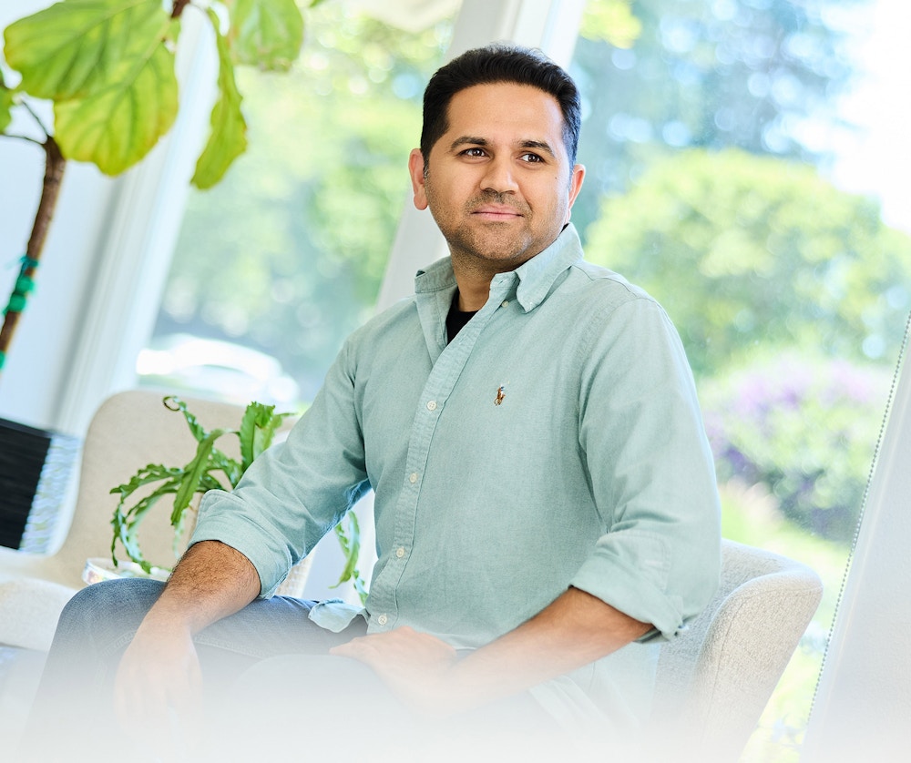 man in a long sleeve light blue shirt