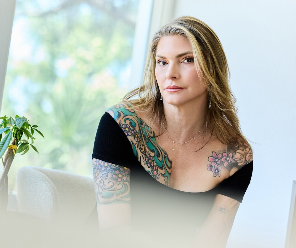 woman with blonde hair and tattoos