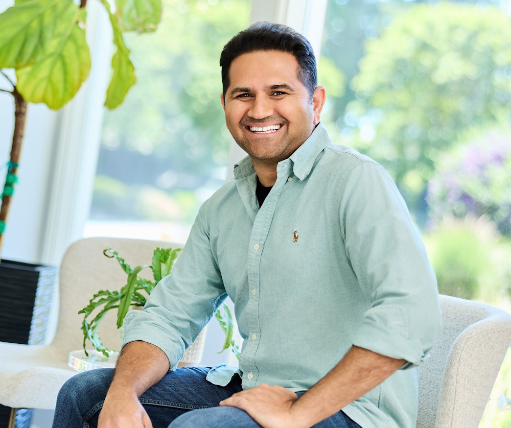 man in a light blue long sleeve button up shirt