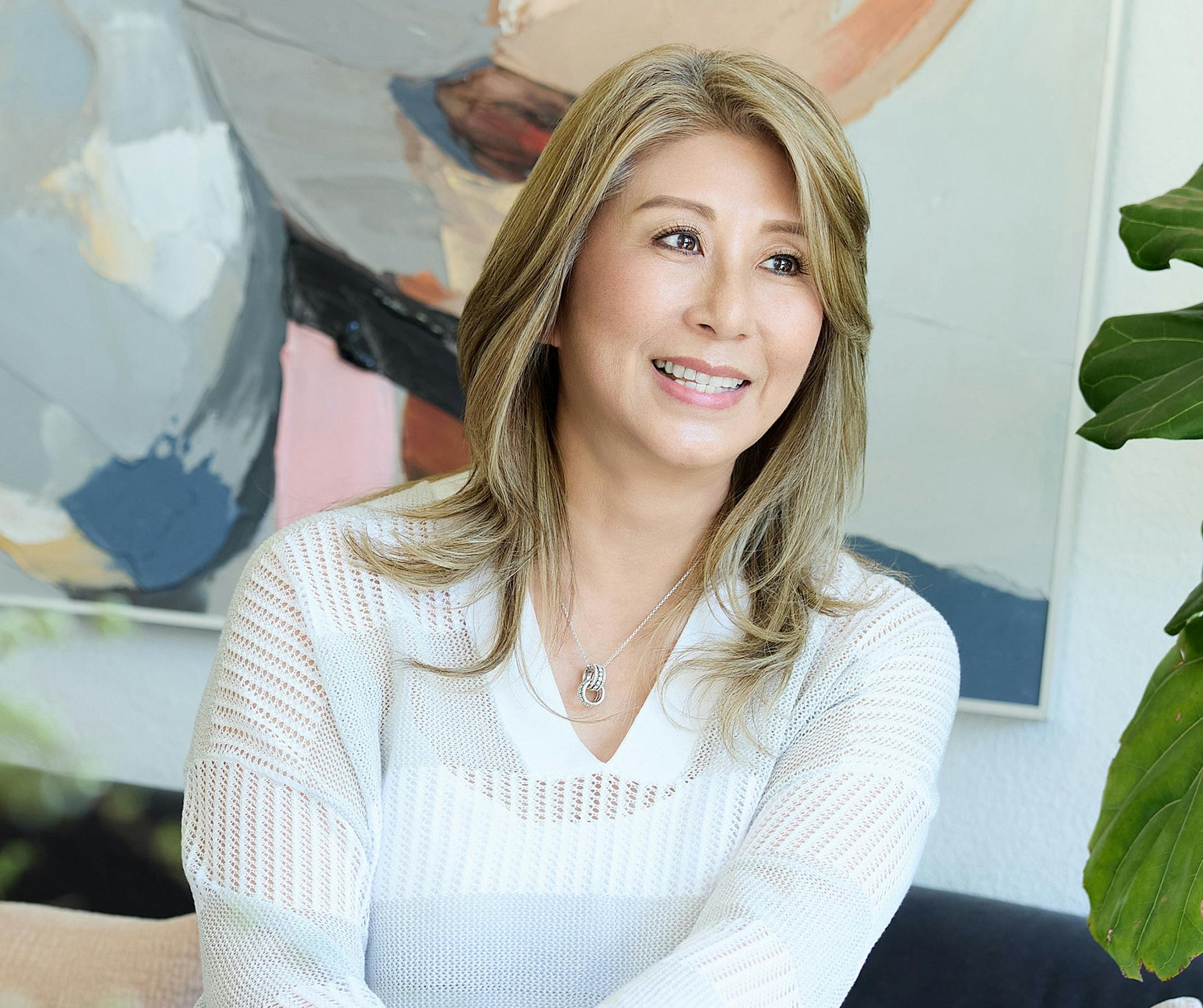 woman wearing a white sweater