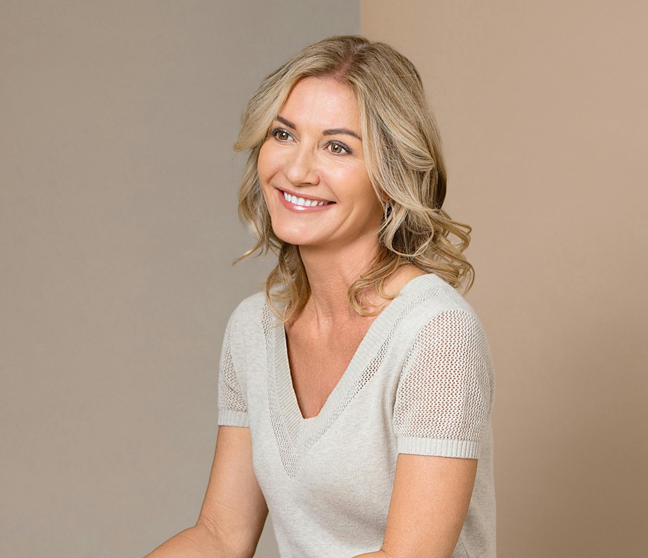 woman wearing a grey sweater top