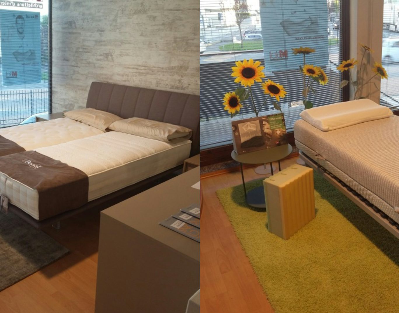 Letti matrimoniali con testata imbottita e materassi in esposizione in showroom con ampie finestre e arredi moderni.