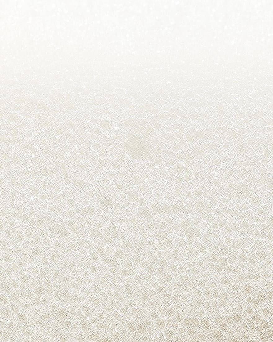 Superficie bianca con texture a piccoli cerchi interconnessi che formano un motivo uniforme e morbido.