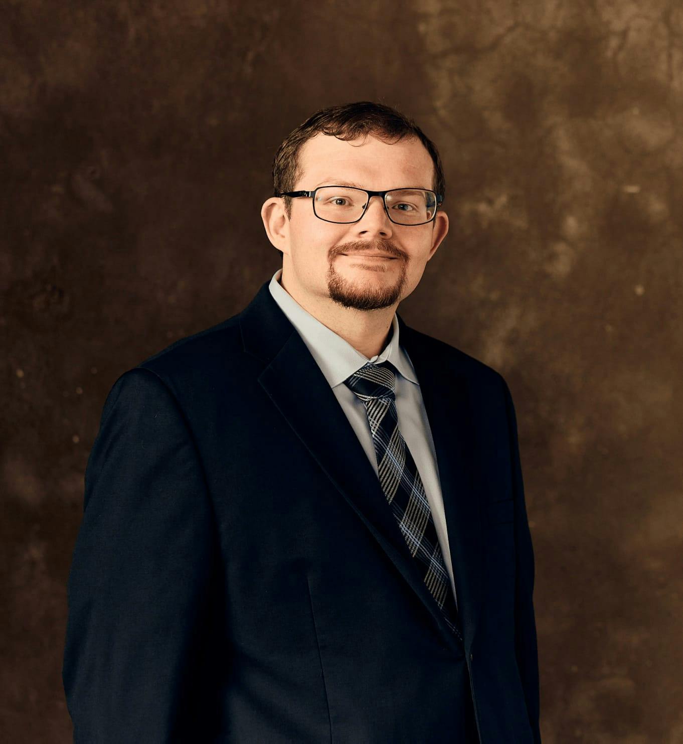 Man in a suit and glasses
