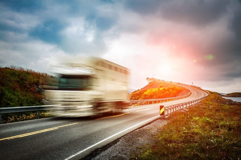 RV driving fast down a highway
