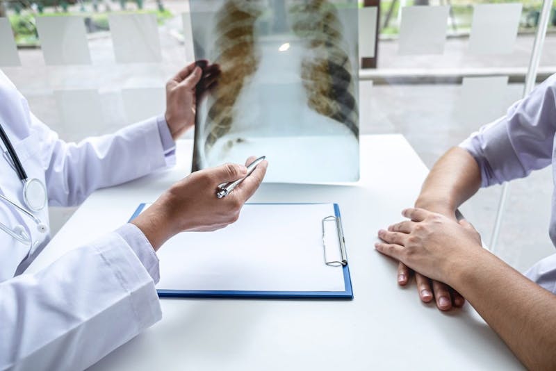 doctor and patient looking at an x-ray
