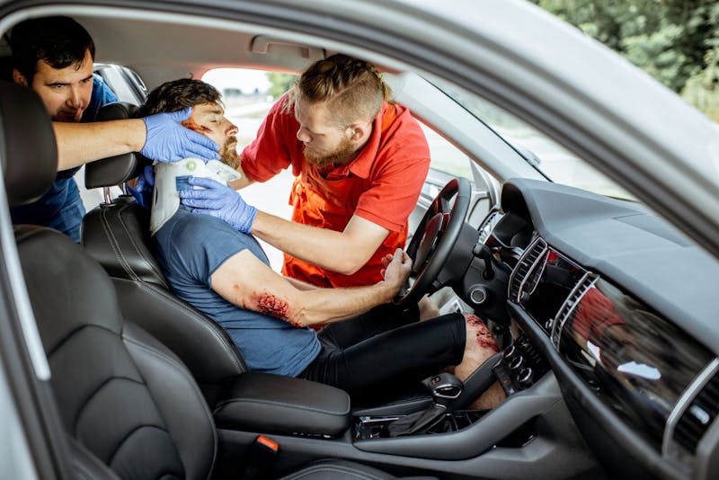man getting medical attention in a carr