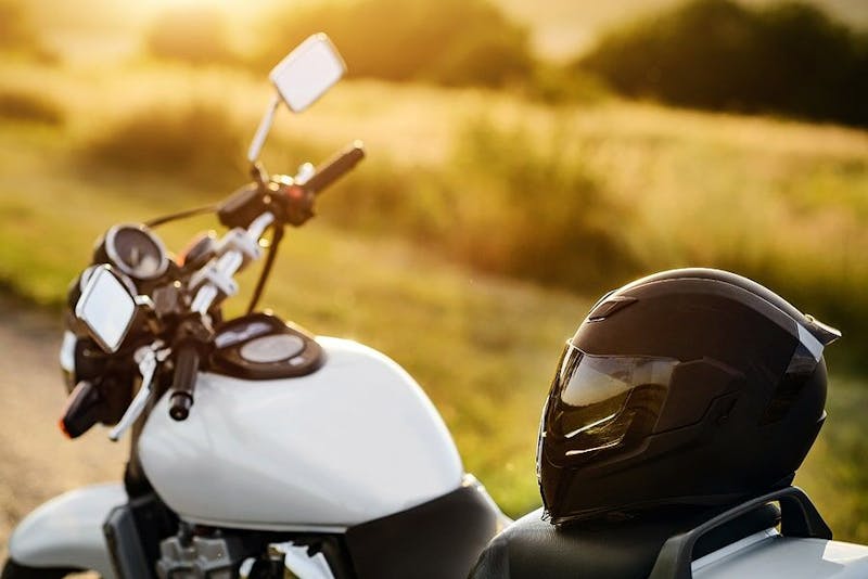 A helmet resting on motorcycle