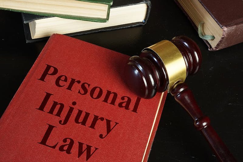 gavel and a book that says Personal Injury Law