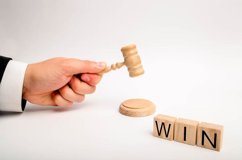 Small gavel and a sign reading