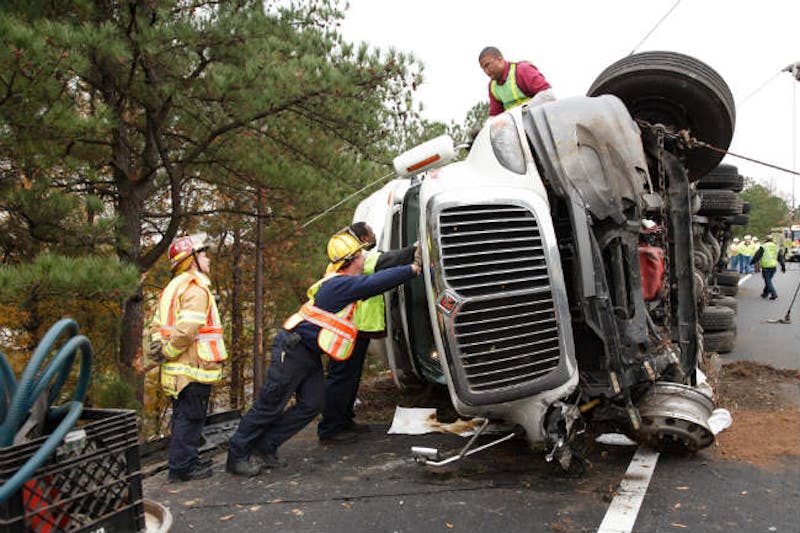 big rig on it's side on the road