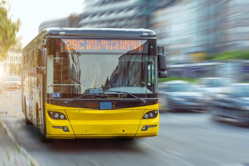 Bus driving down a road