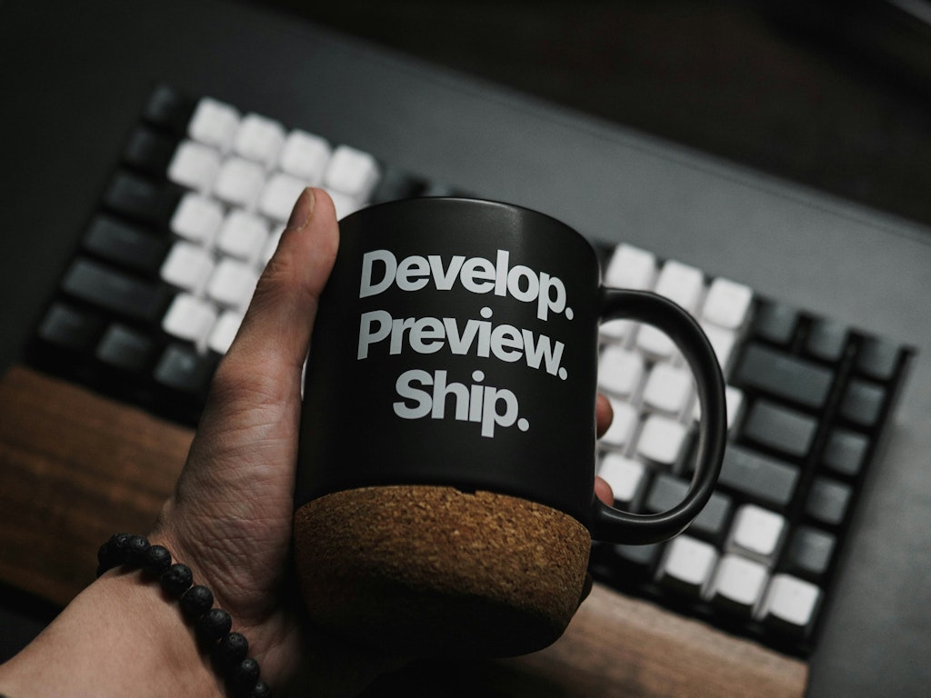 Photo by Kevin Canlas on Unsplash A person holding a coffee mug