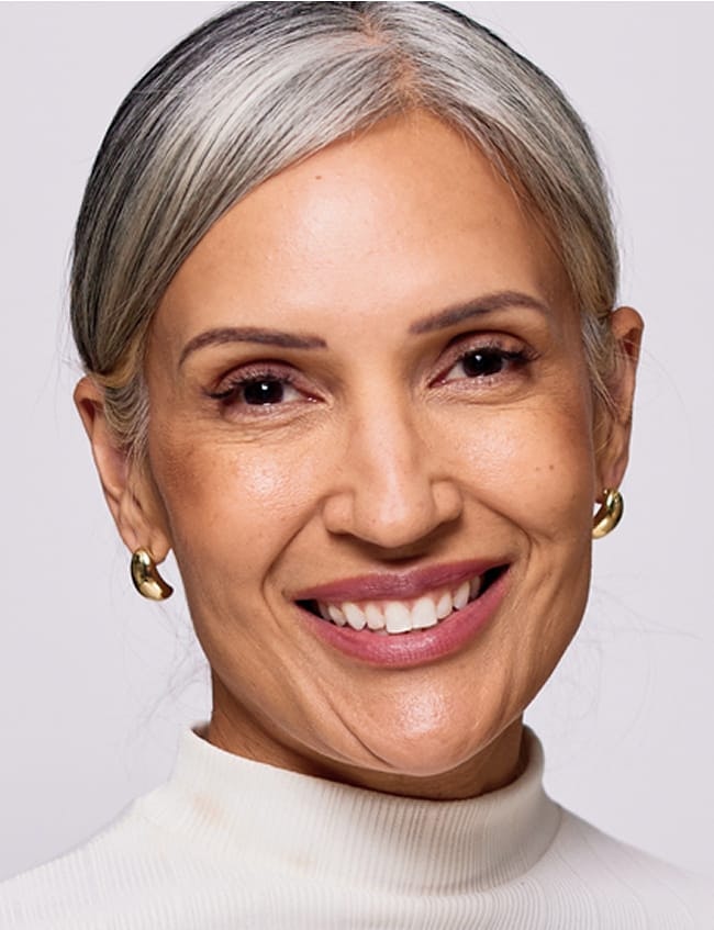 woman with grey hair slicked back