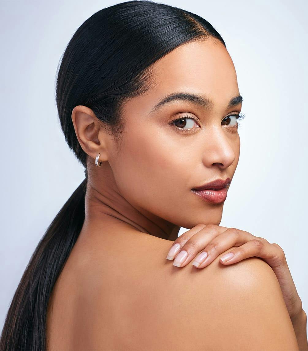 woman with her hair in a low ponytail