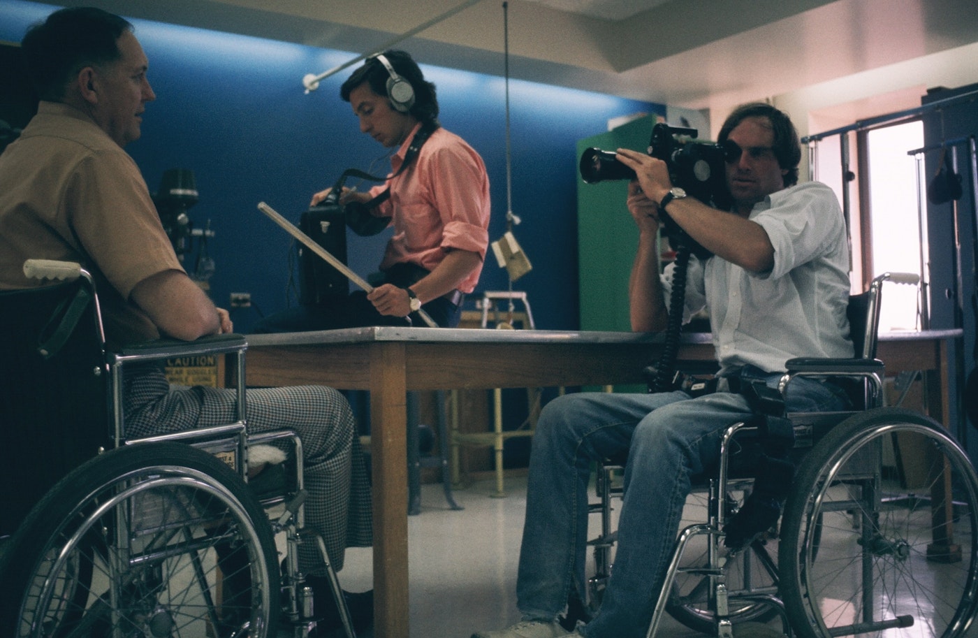 Barry Corbet films another wheelchair user in a studio