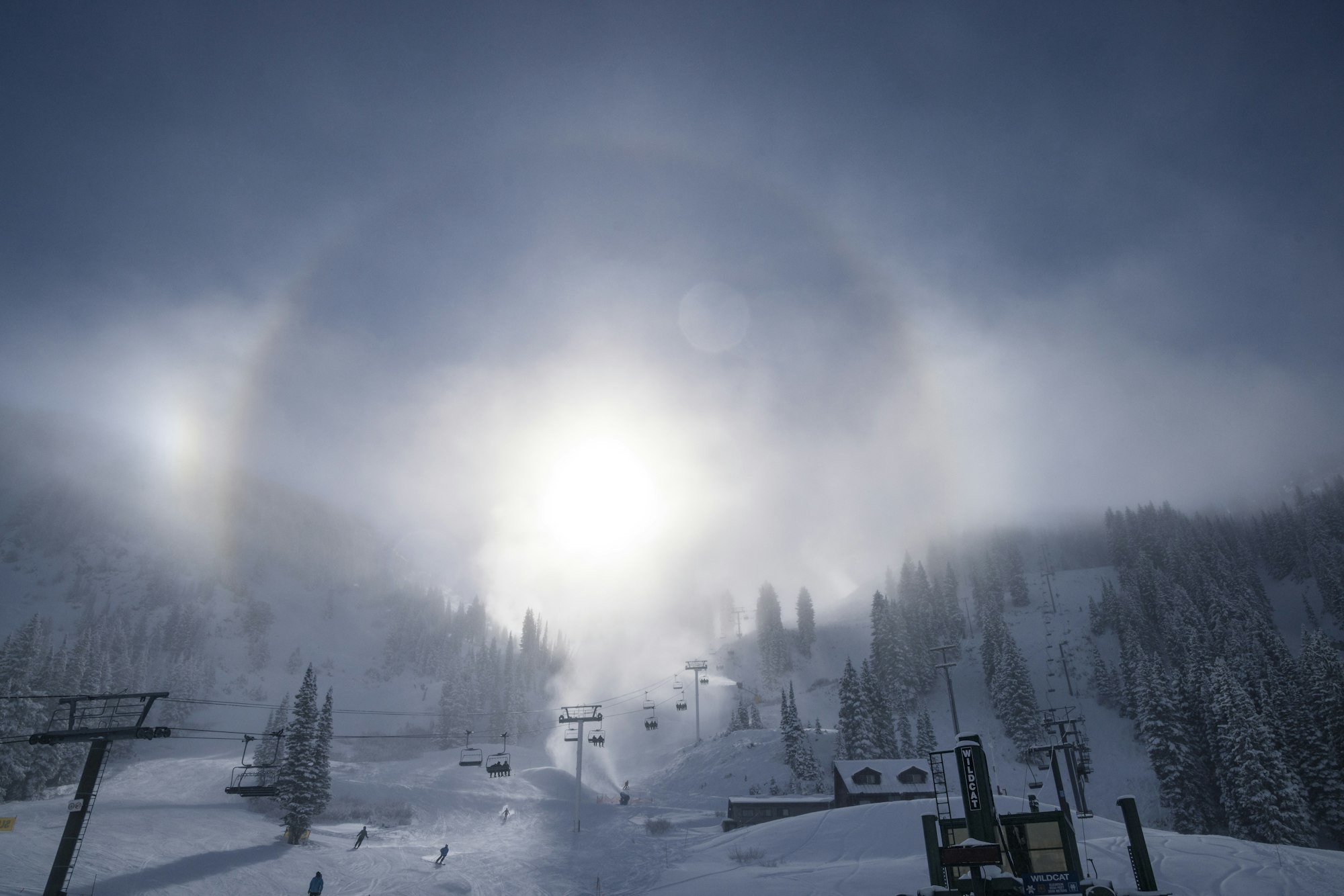 Collins and Wildcat lifts at Alta in the snow on a sunny day