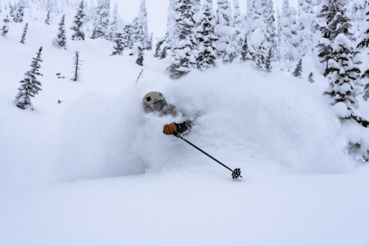 Emily Childs makes a turn in deep snow in the forest