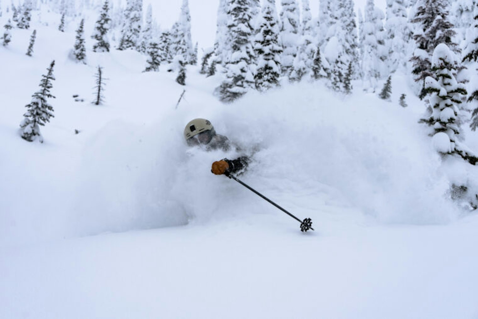 Emily Childs makes a turn in deep snow in the forest