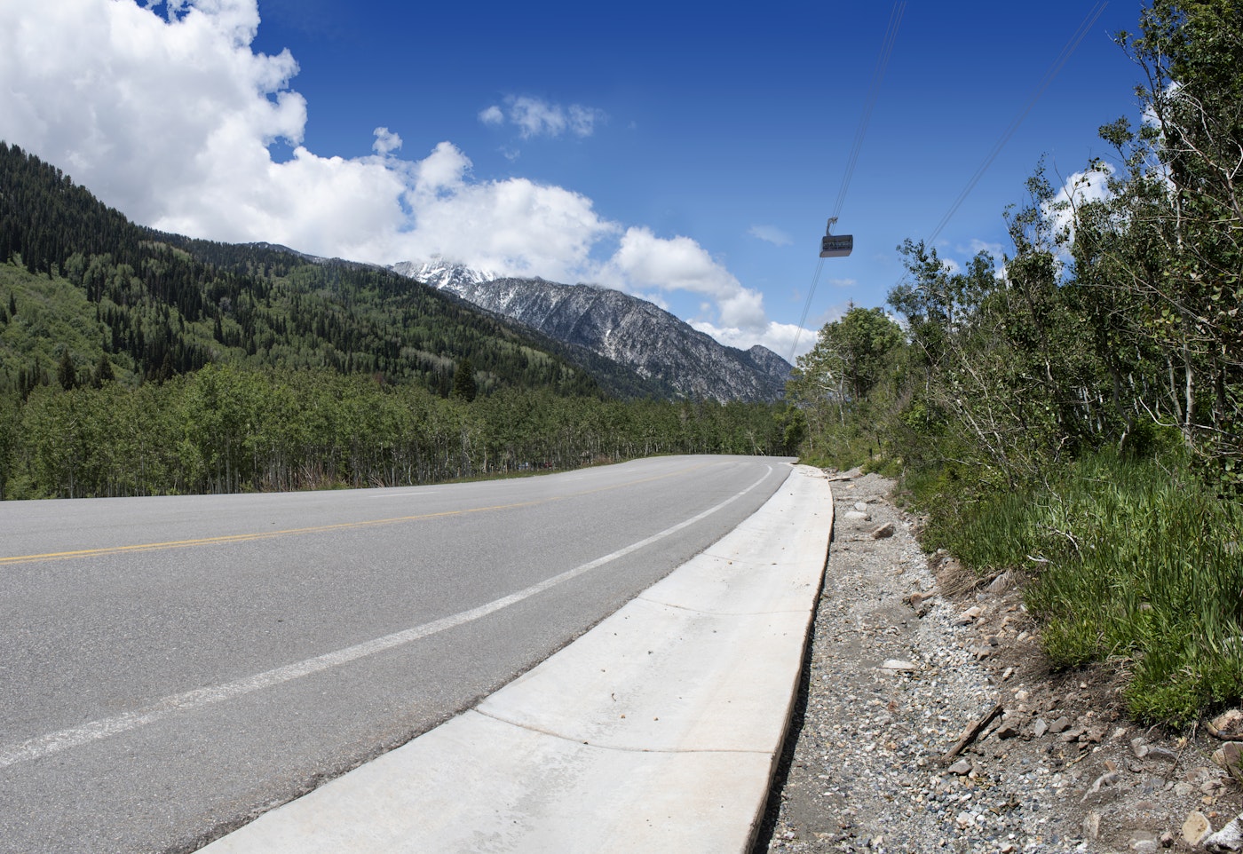 Highway going into the mountains with gondola rendered into it