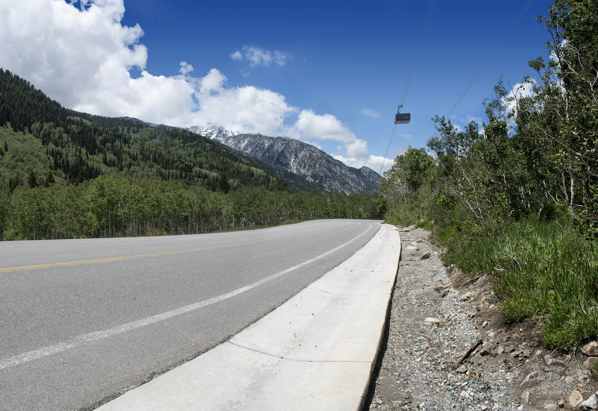 Highway going into the mountains with gondola rendered into it
