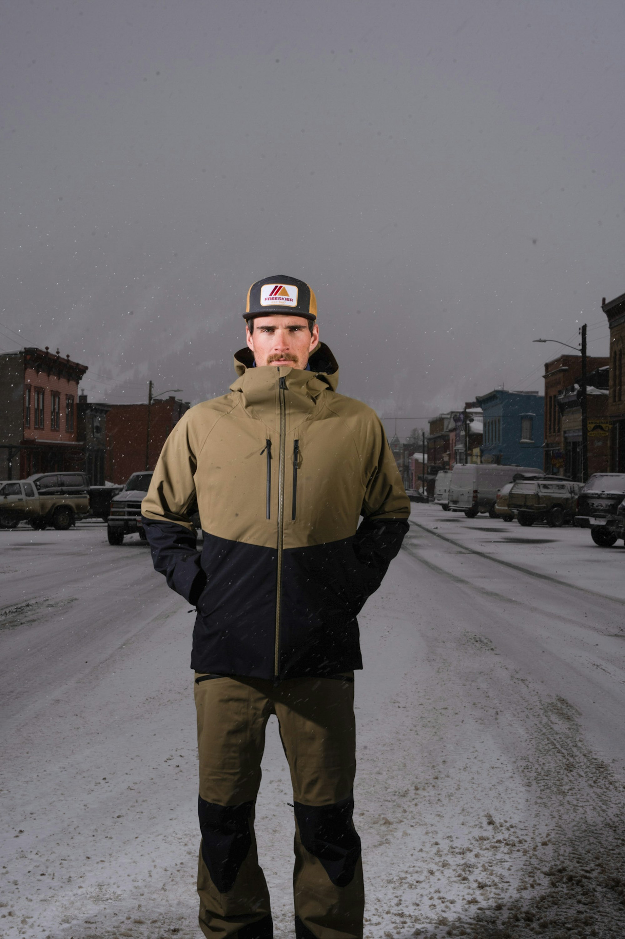 Man posing in the Rossignol Men's Evader ski kit