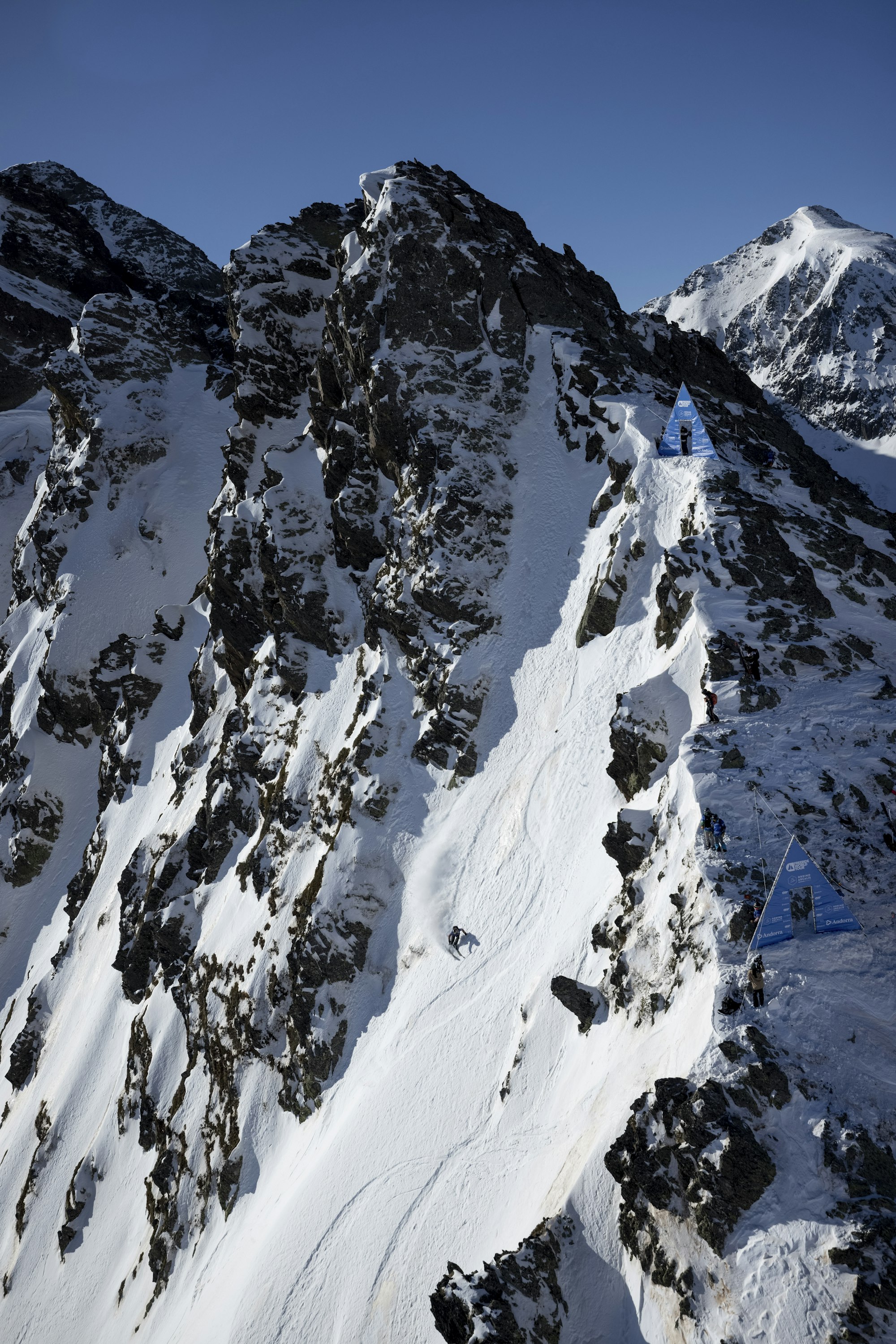 A Freeride world tour start gate nestled into a mountain ridge