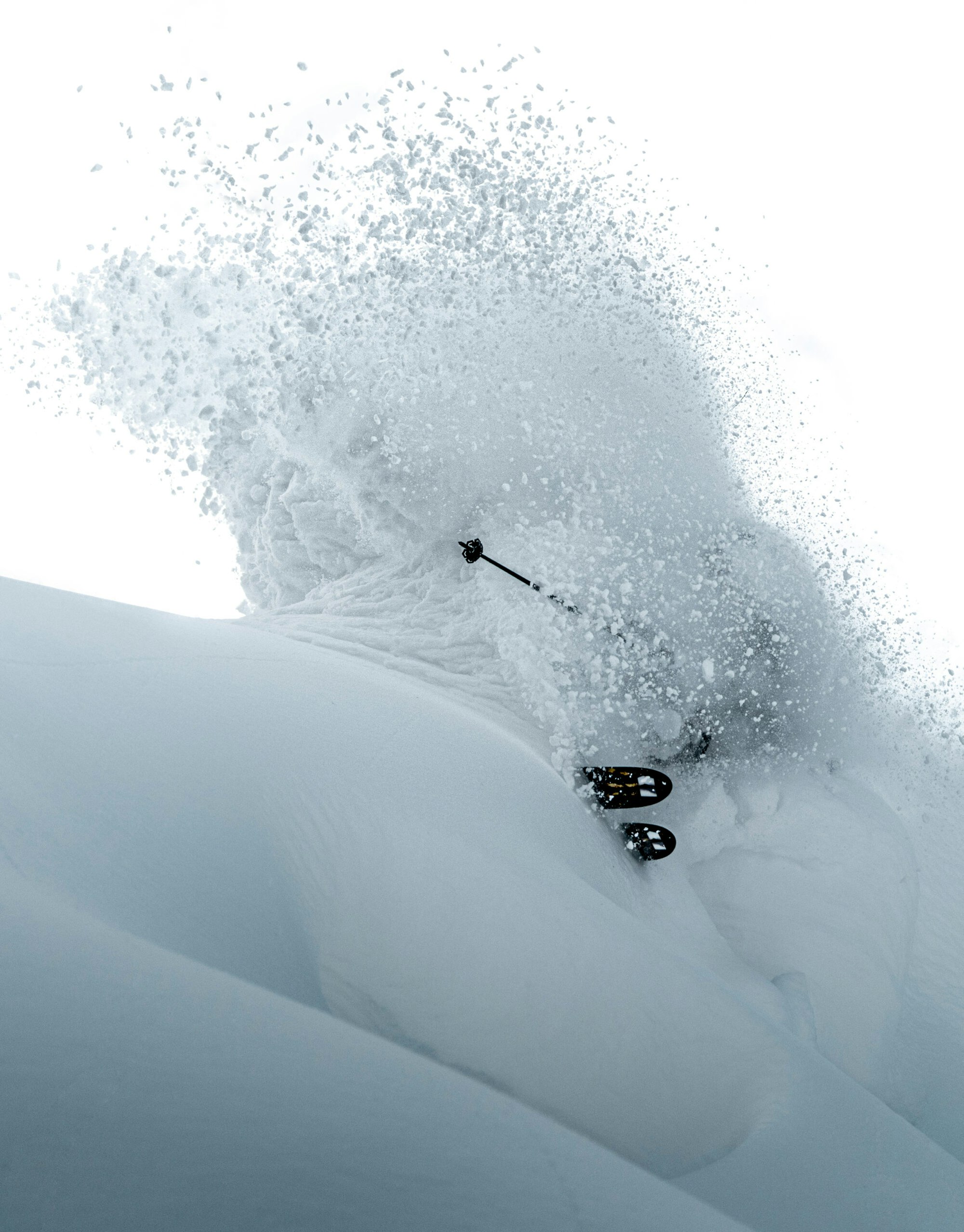 Skier Josh Abdsenger turning through deep powder snow in Flachauwinkl, But