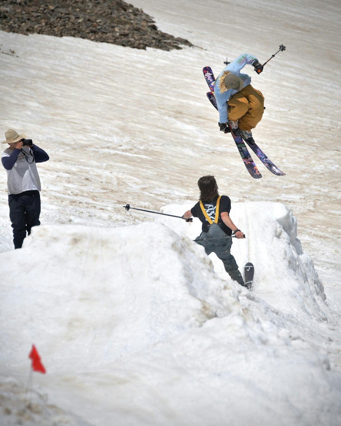 Skiers on peak 10 riding off a boater