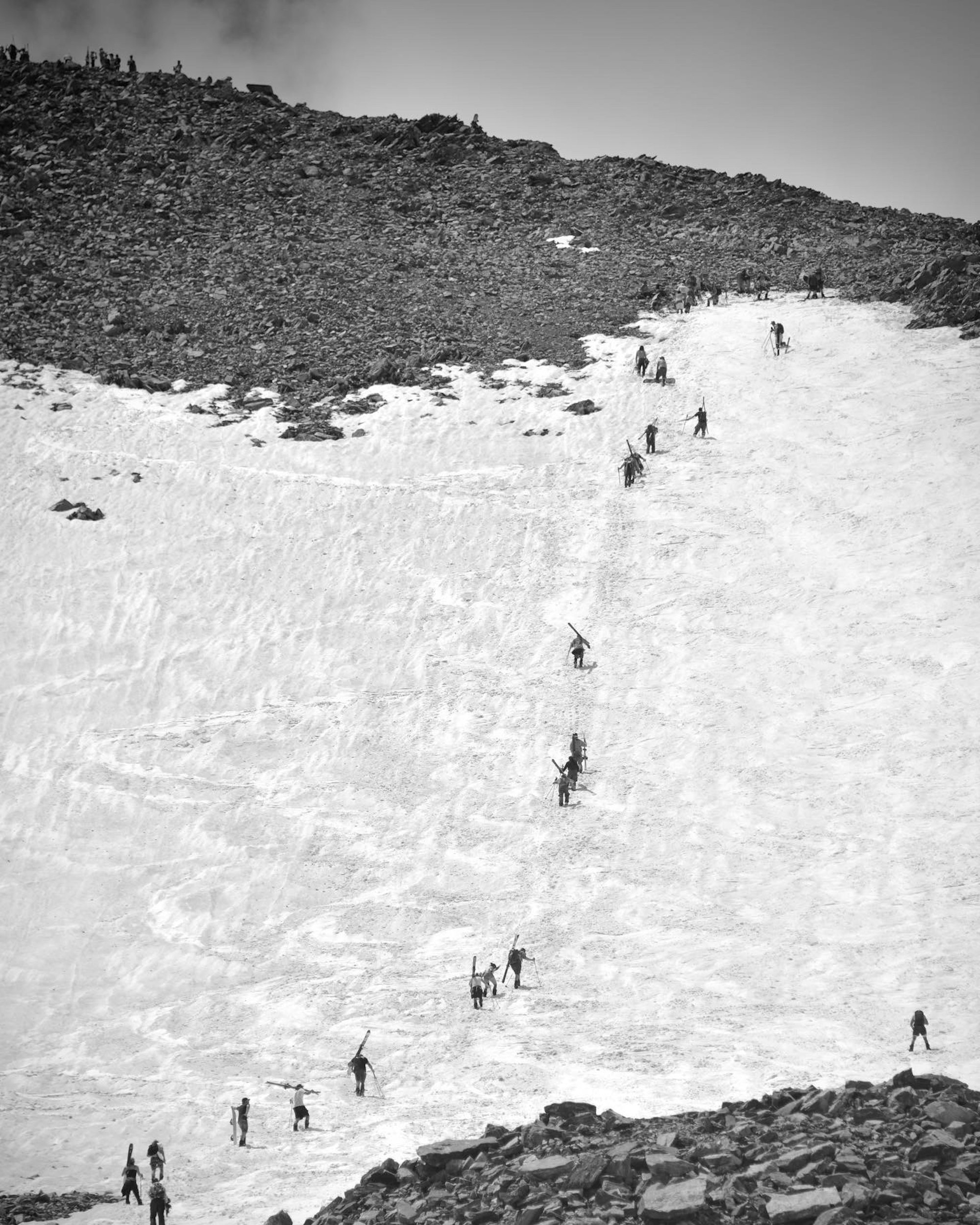 Skiers hike up Fourth of July bowl in Breckenridge, CO