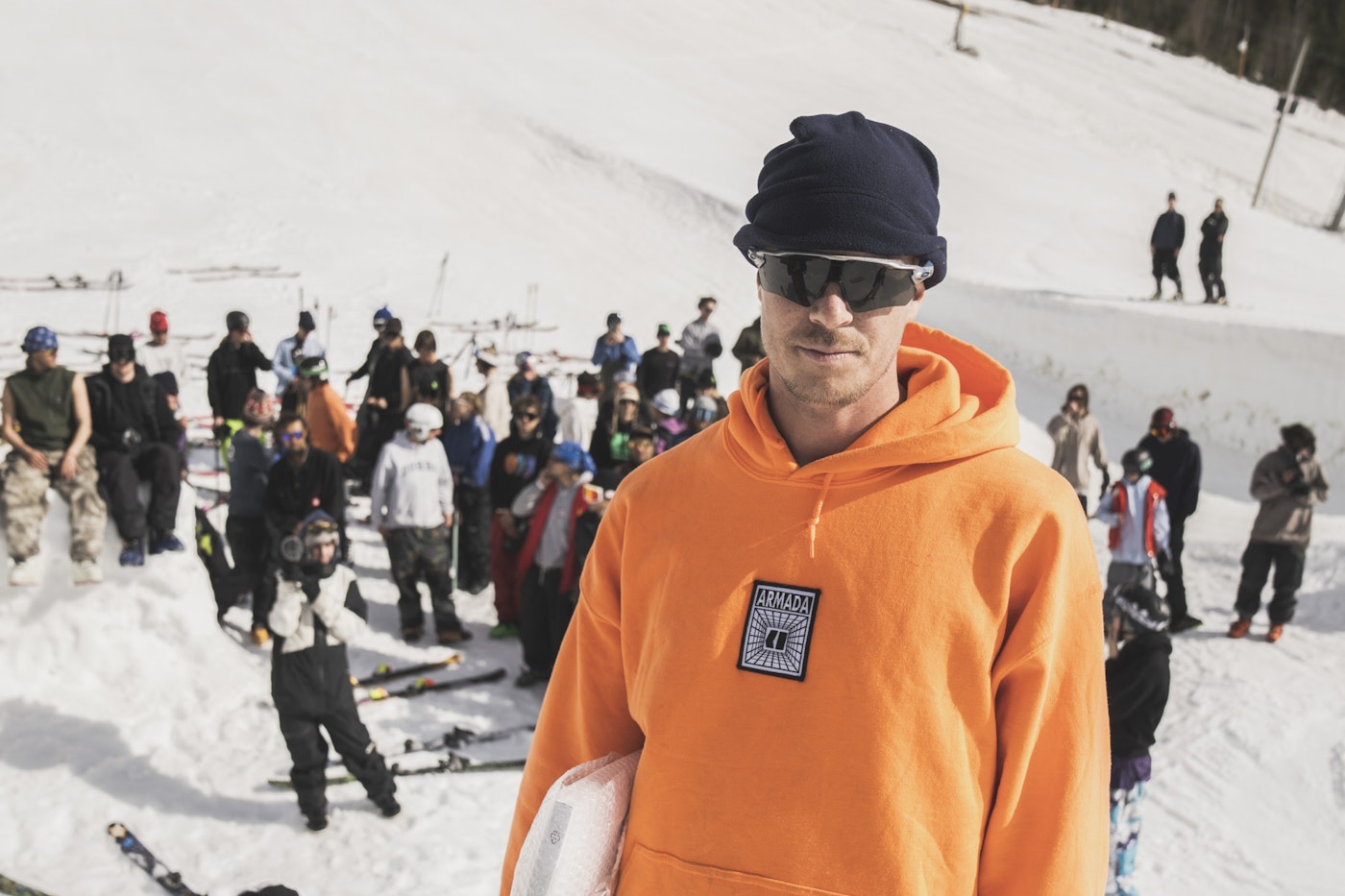 Skier Kim Boberg posing in front of a group of people in the snow