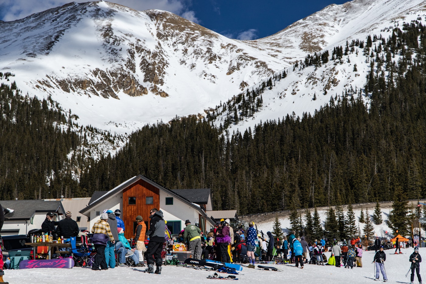 Skiers gather at the base lodge of Arapahoe Basin on