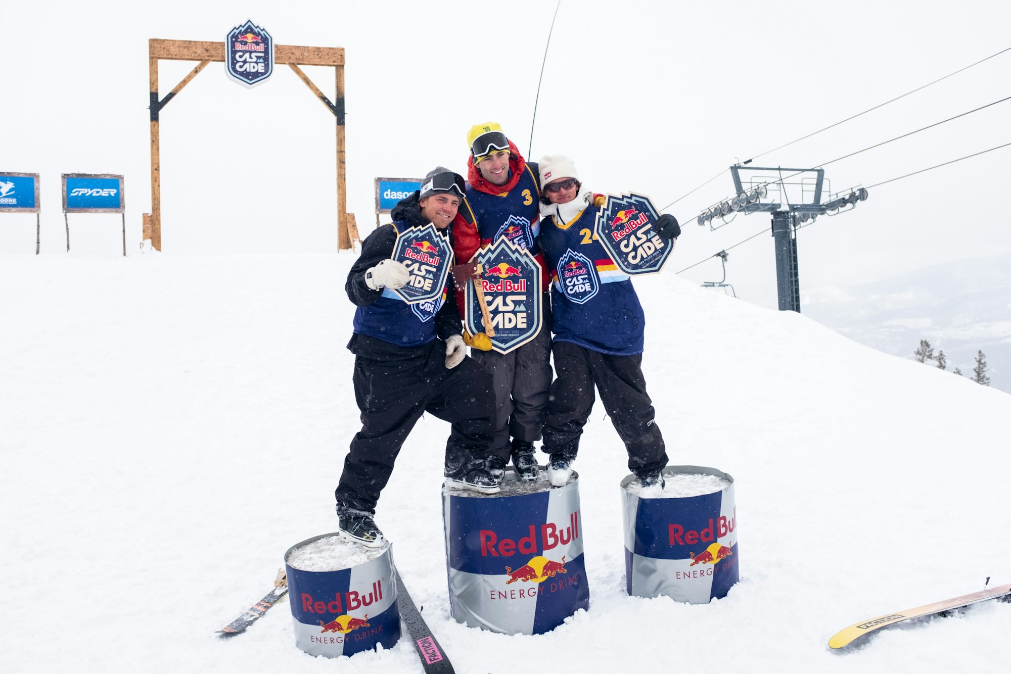 Skiers Alex Hall, Hunter Hess, and Mac Forehand on the Red Bull cascade podium in the snow