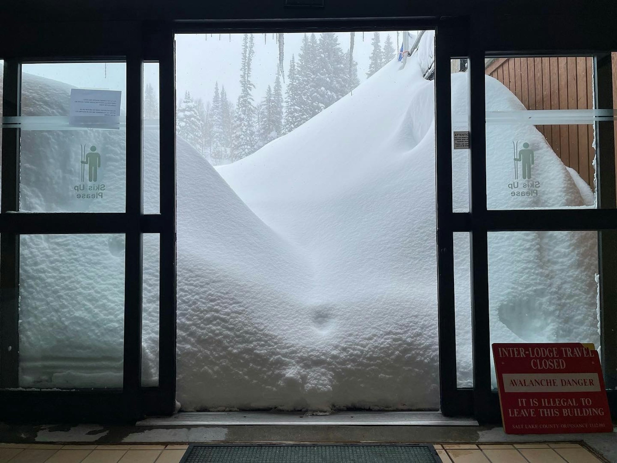 Sliding door outside Snowbird ski resort surrounded by feet of snow