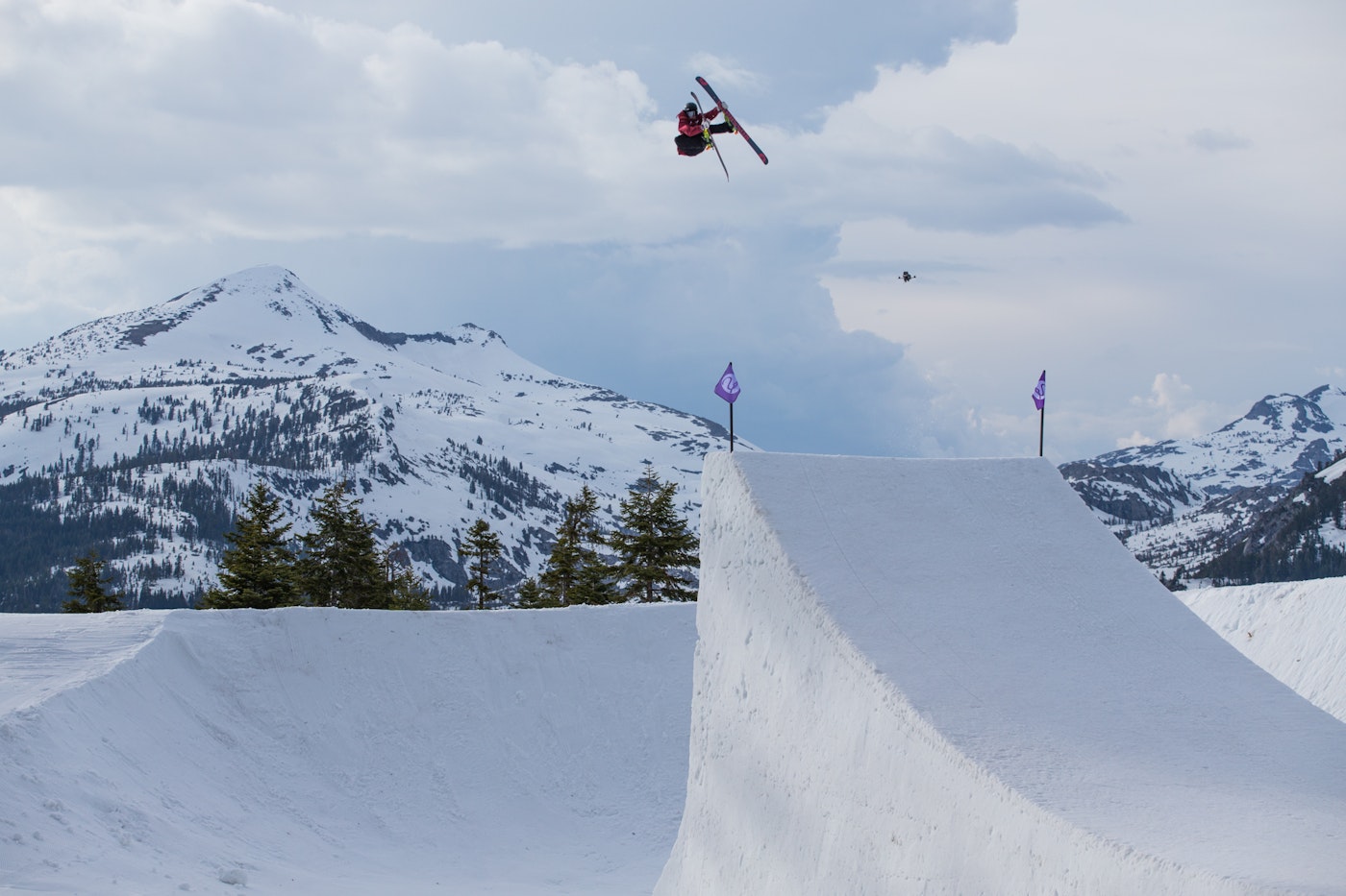 John Brown skiing offf a huge jump in the clouds in Utah