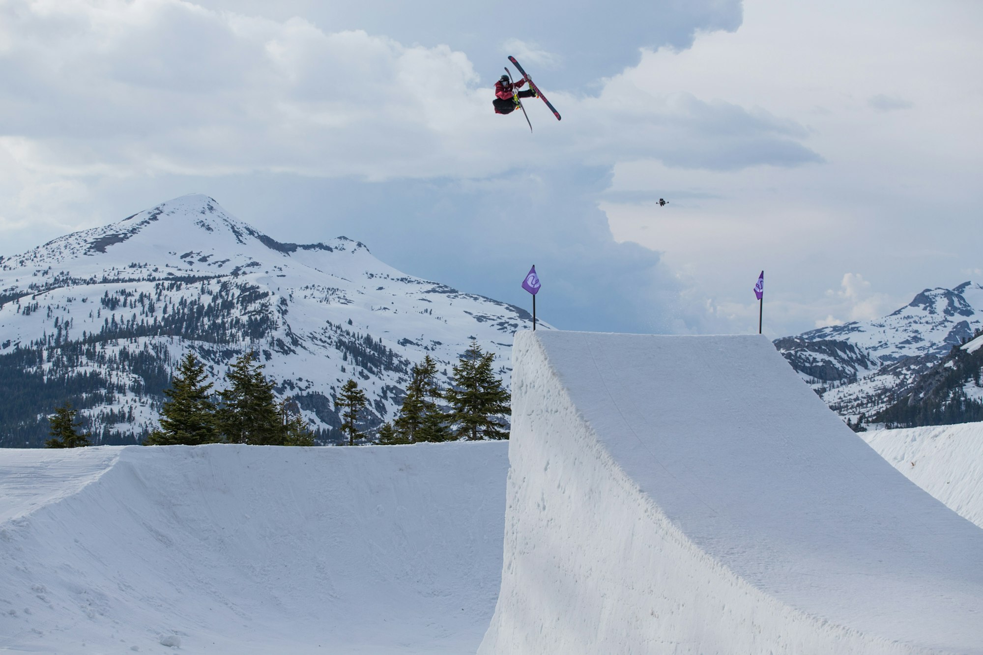 John Brown skiing offf a huge jump in the clouds in Utah