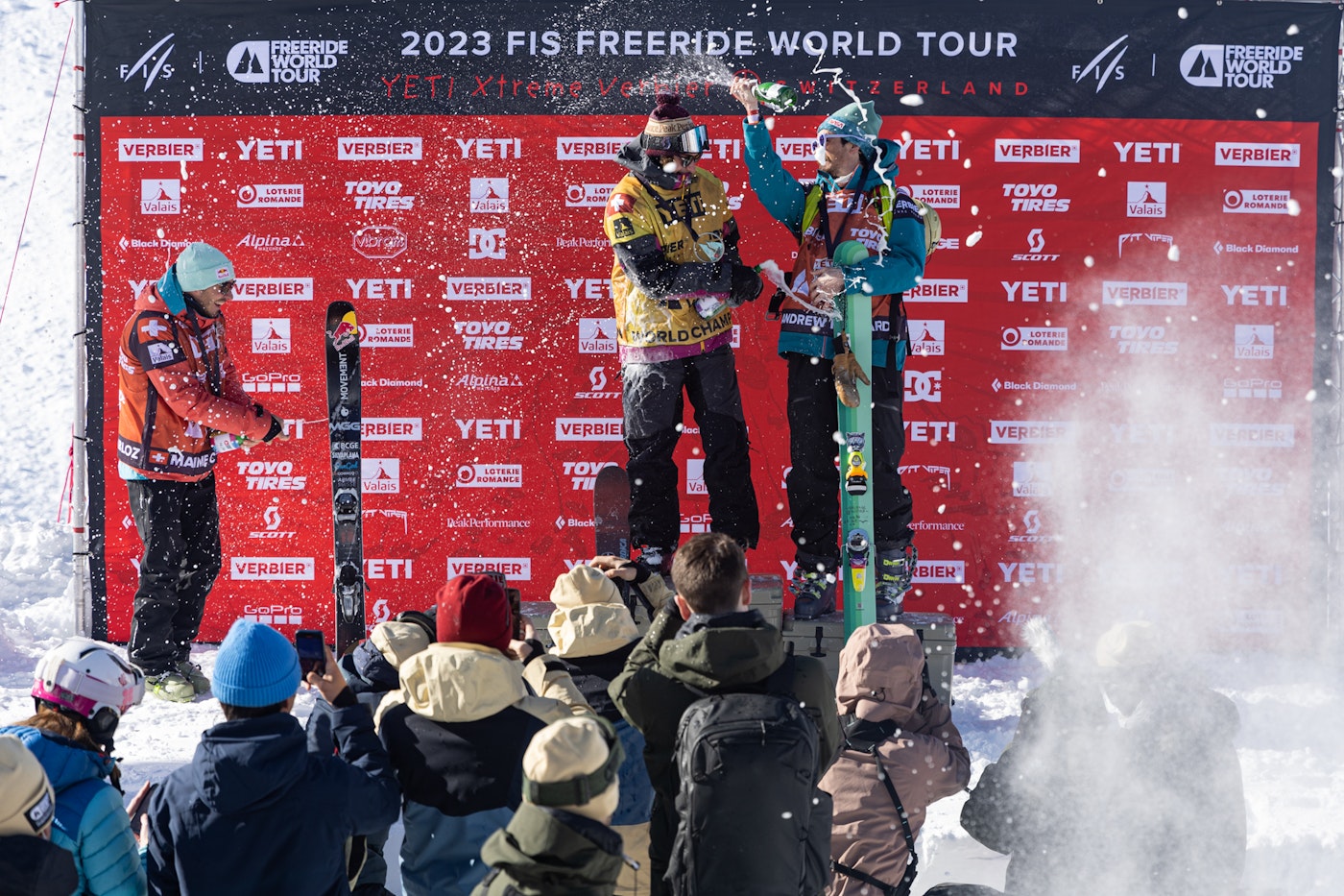 Mens FWT competitors spraying each other with champagne