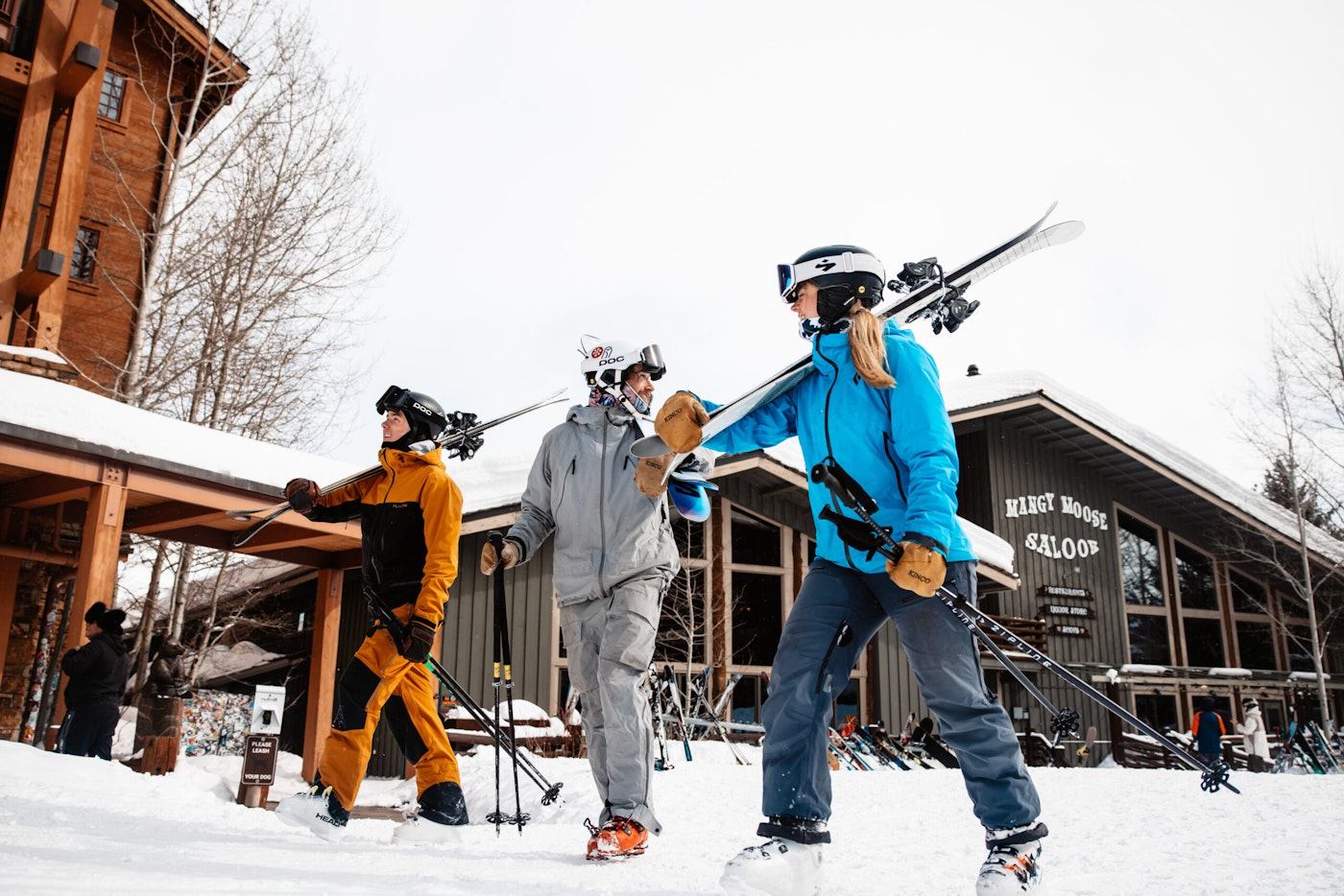 Skiers walking outside a lodge