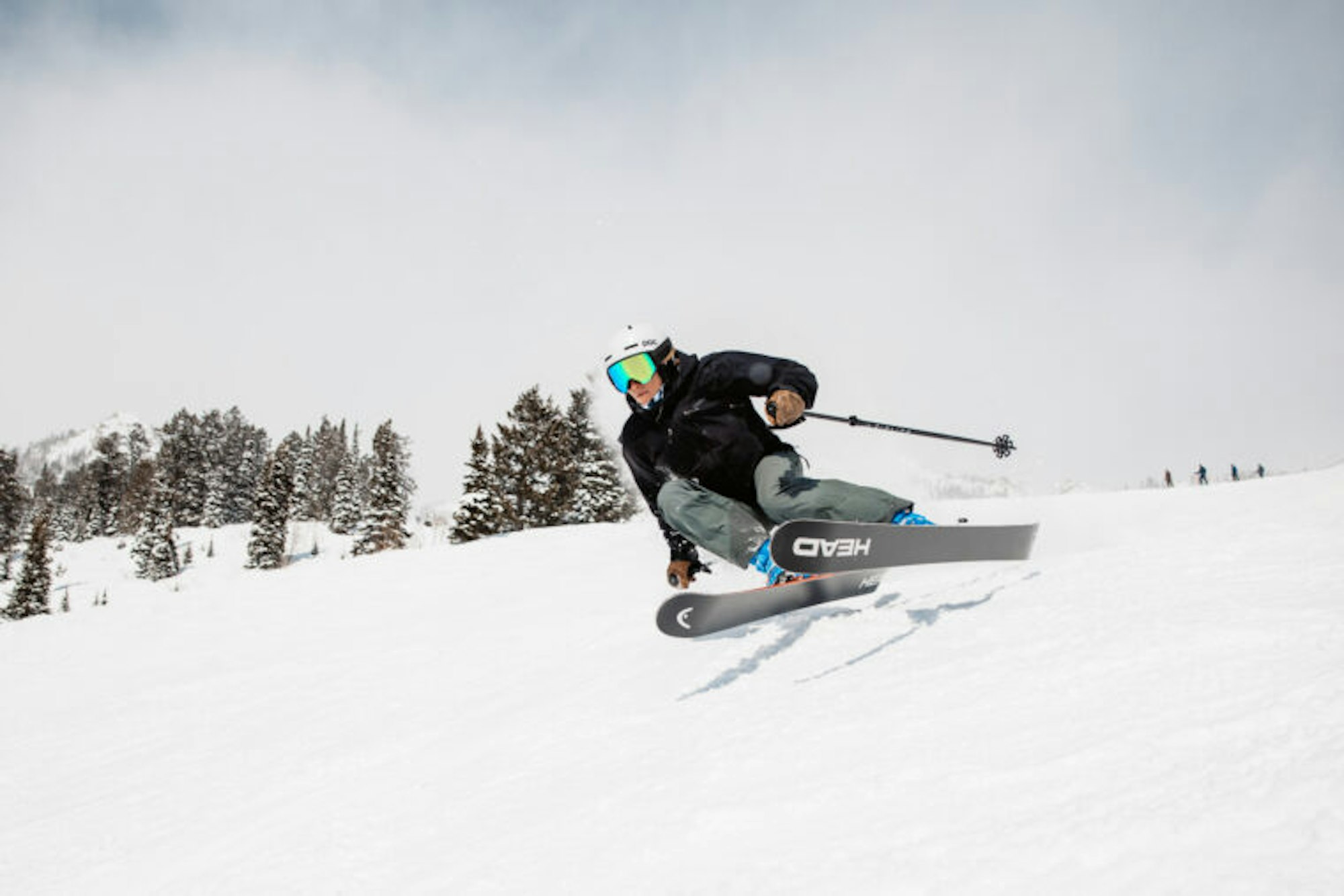 Skier turning down a snowy slope