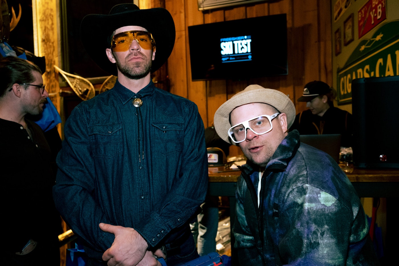 two men in hats at a bar