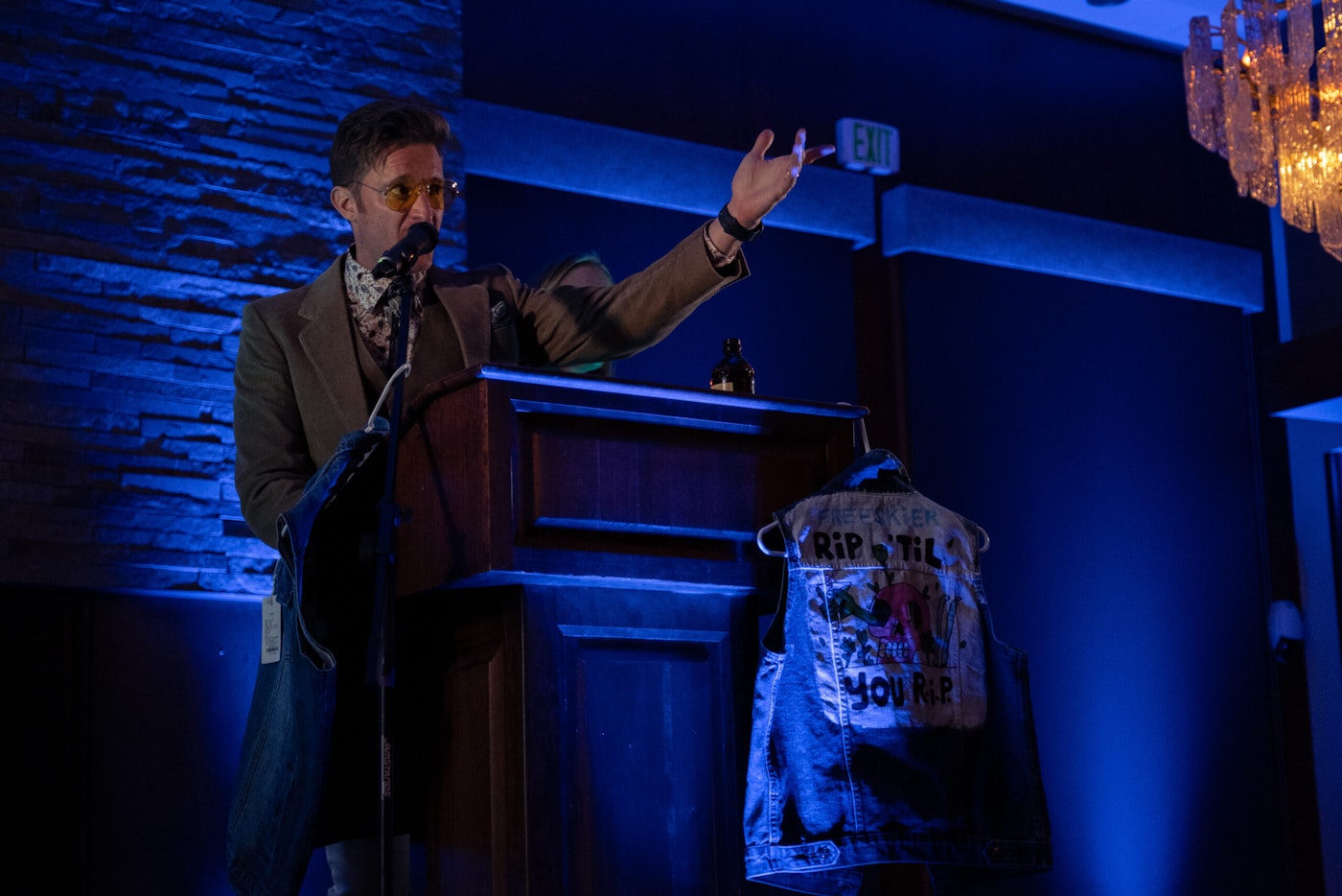 A man makes a speech from a podium